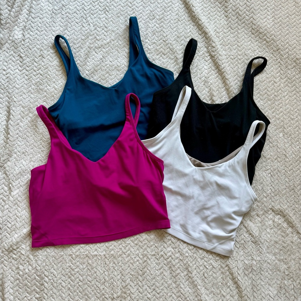 Set of Four Lululemon Tops in Blue, Black, Pink, and White